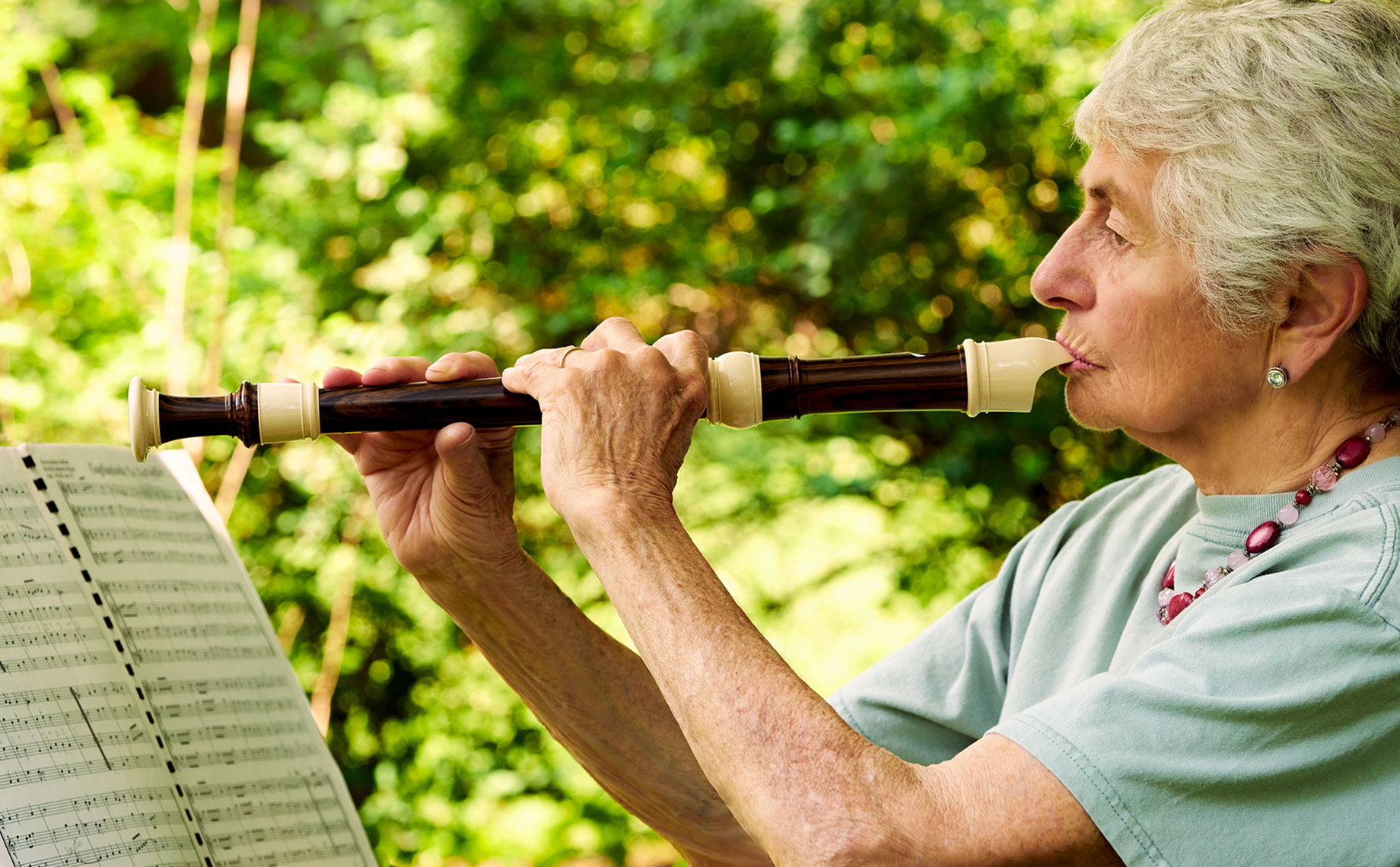 Older Woman Playing Instrument in Profile-recorder-06-23-17_Carolie0293-F